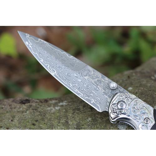 Steel patterned black fox Damascus folding knife