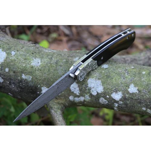 Steel patterned black fox Damascus folding knife