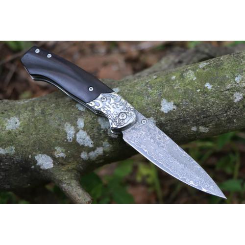Steel patterned black fox Damascus folding knife