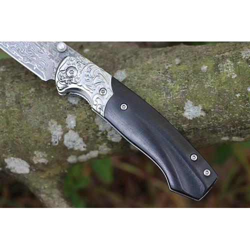 Steel patterned black fox Damascus folding knife