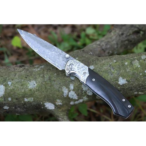Steel patterned black fox Damascus folding knife
