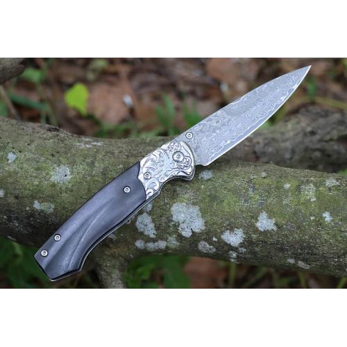 Steel patterned black fox Damascus folding knife