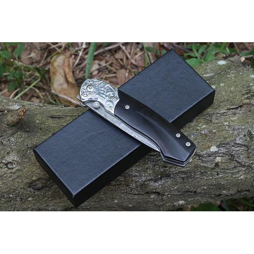Steel patterned black fox Damascus folding knife